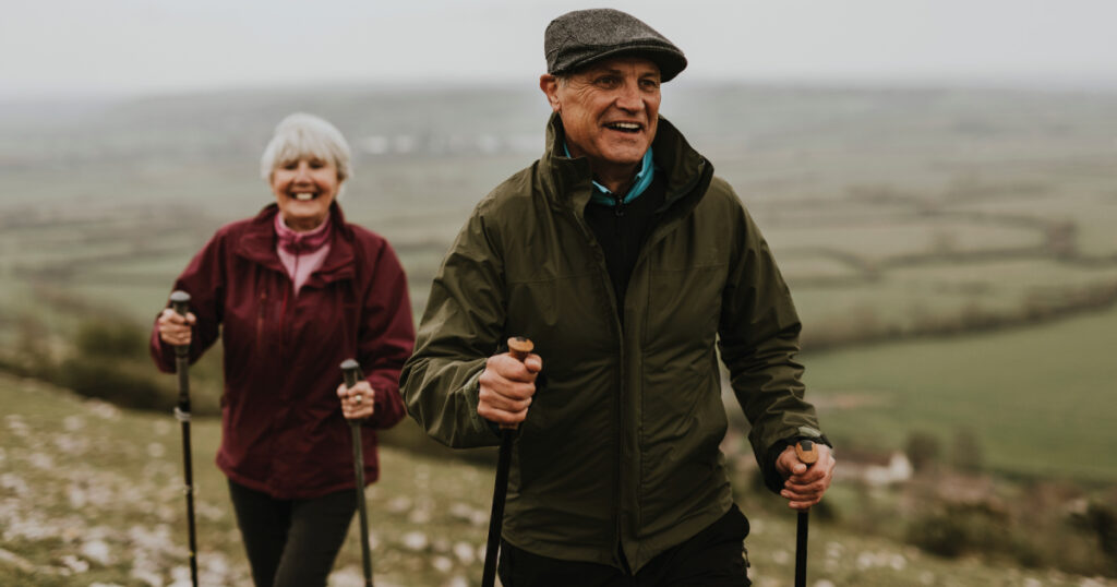 Older couple hiking in countryside