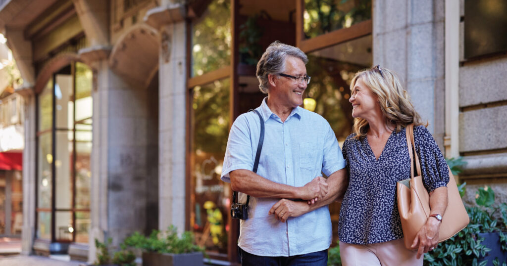 Couple walking outside in shopping district