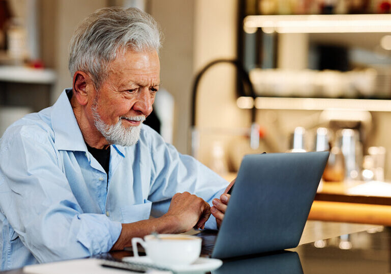 Man researching on laptop