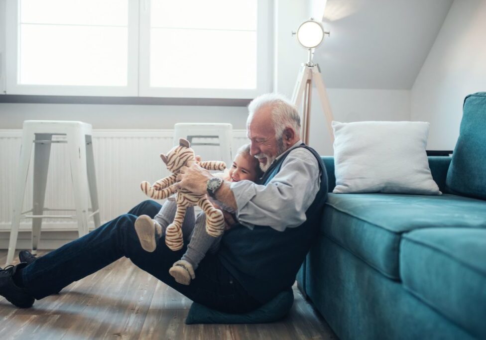 Grandfather and daughter playing