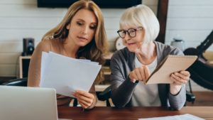 Adult daughter and mother having serious conversation