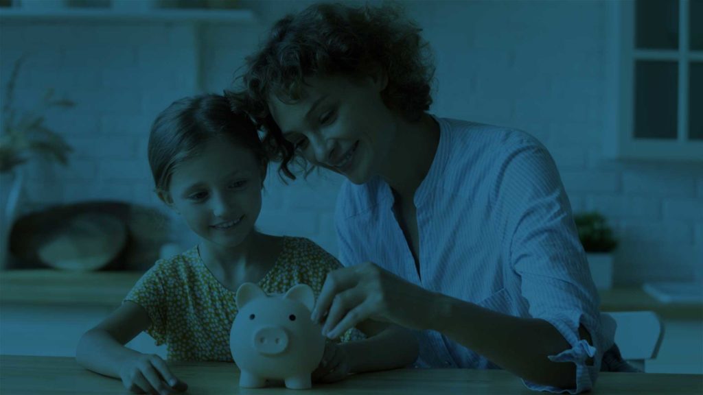 Woman and little girl with piggy bank