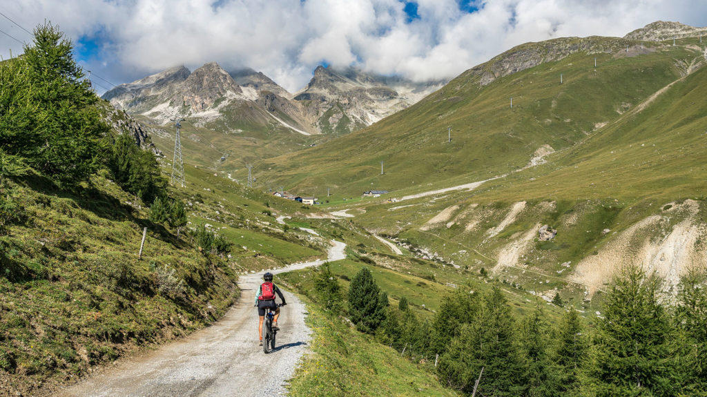 active senior woman, riding her e-mountainbike on the famous Suv