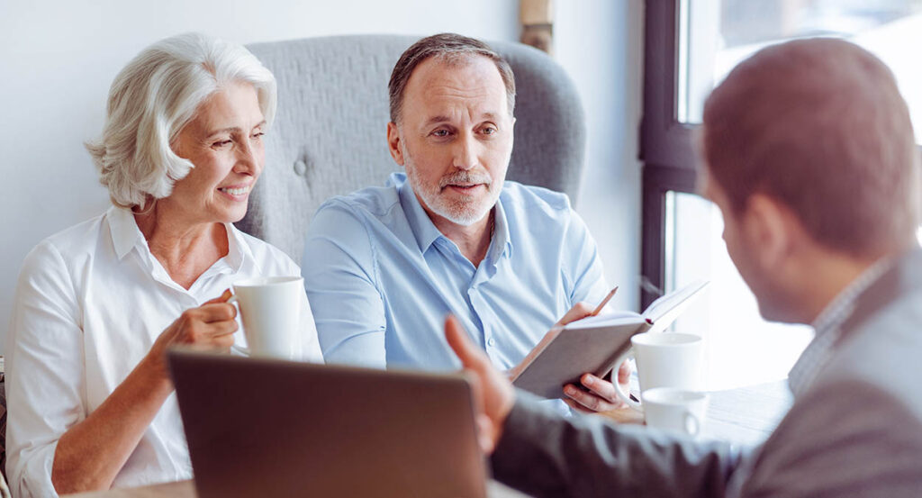 Mature couple has annual review meeting with financial advisor