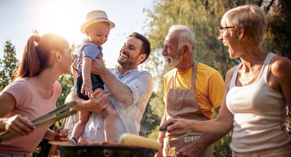 multigenerational family has relaxing summer barbecue