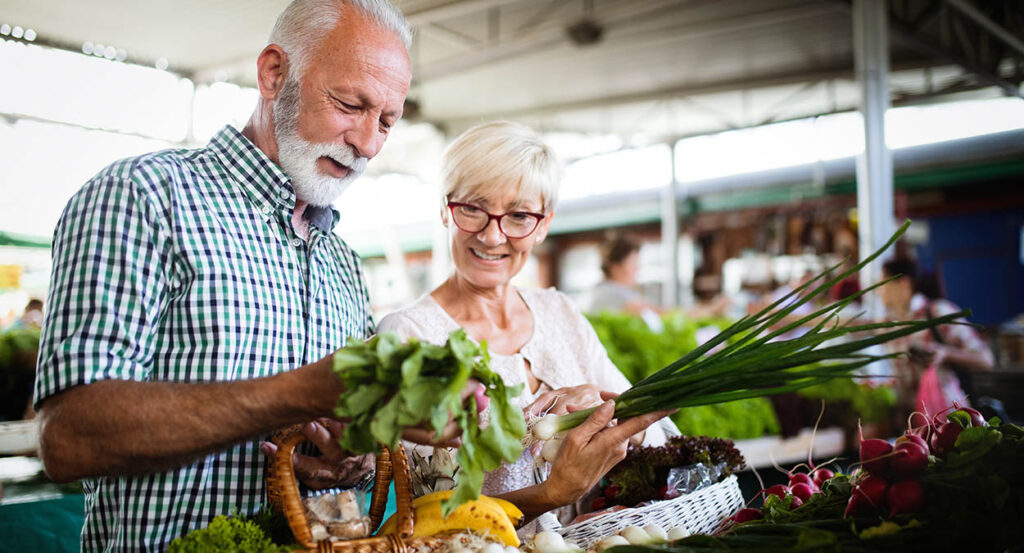 senior couple shops while discussing their long-term care policy