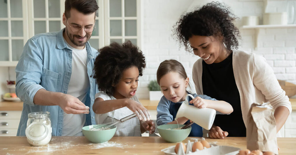 Blended family has fun together in the kitchen
