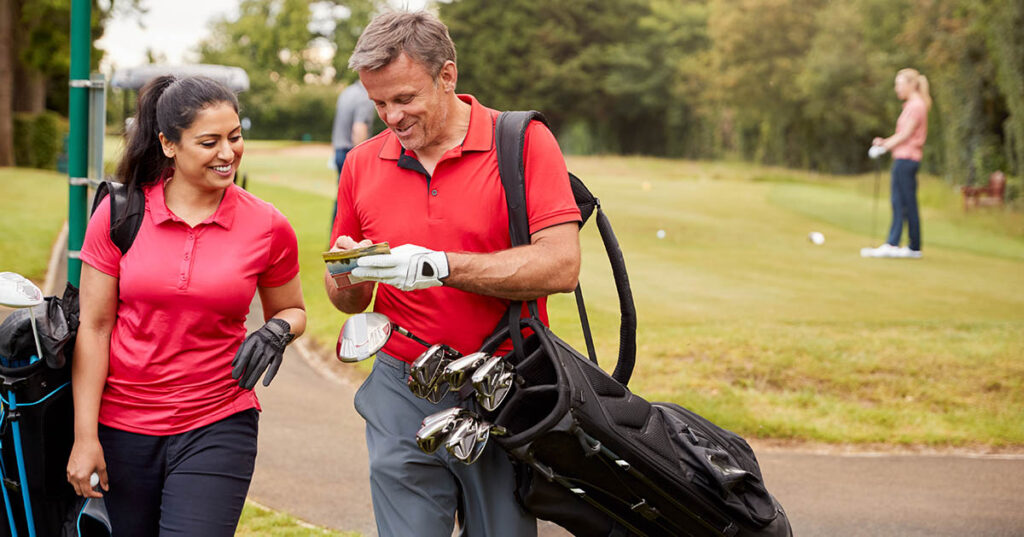 Financially Independent Couple Playing a Round of Golf