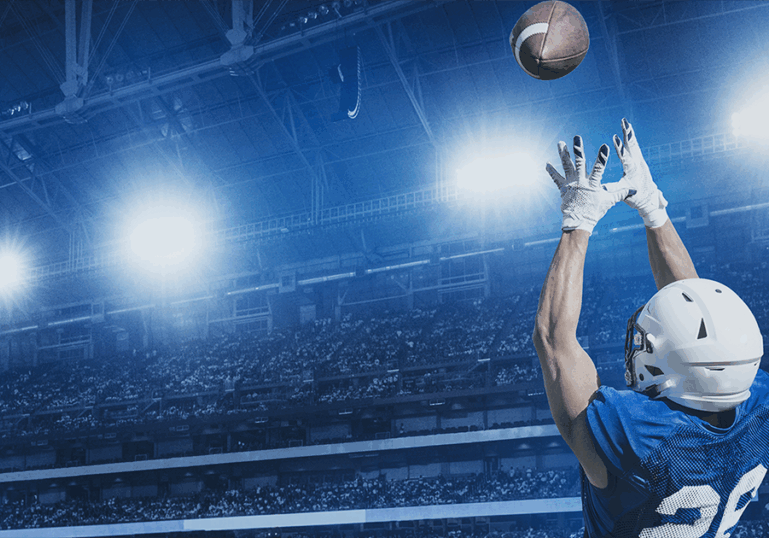 Football player catching football