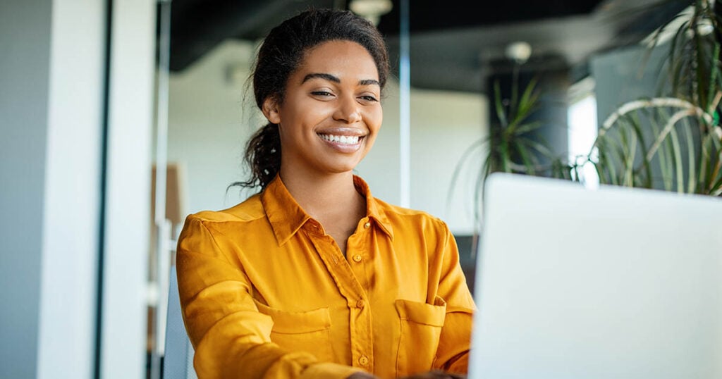 Woman selects benefits during open enrollment