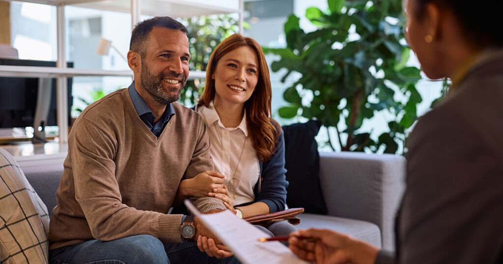 High-net-worth investor in business suit meeting with financial advisor to discuss private credit investment opportunities