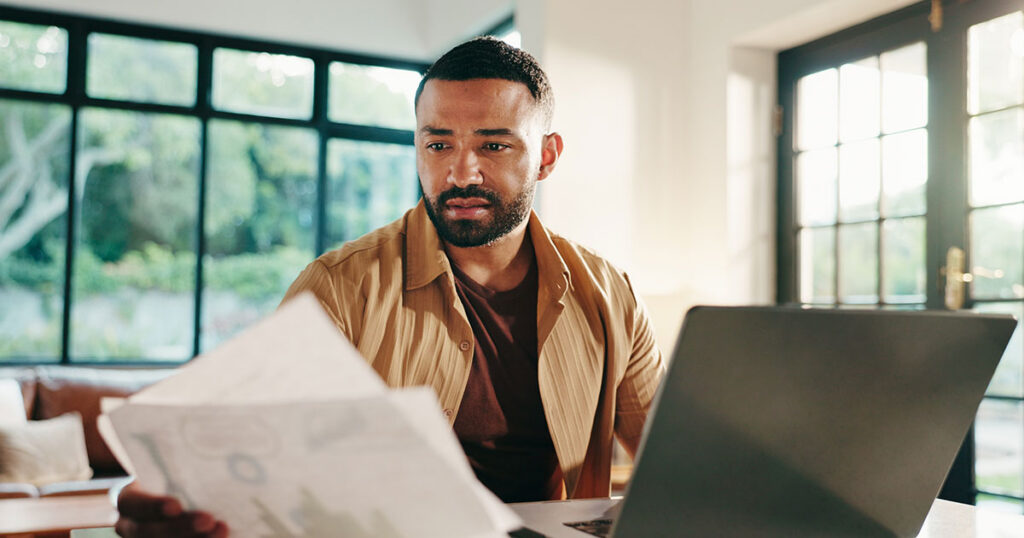 Man looks at IRA paperwork