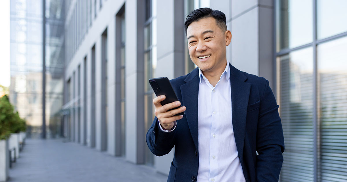 Business man looking at phone