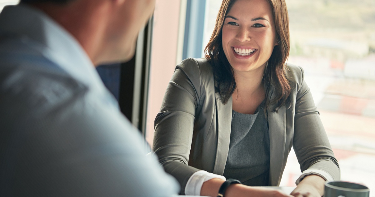 Corporate executive meeting one-on-one with a financial advisor, representing why many executives choose an integrated private wealth management team