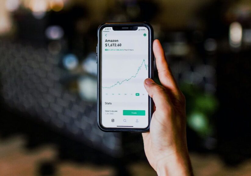Person checking Amazon stats on phone photo