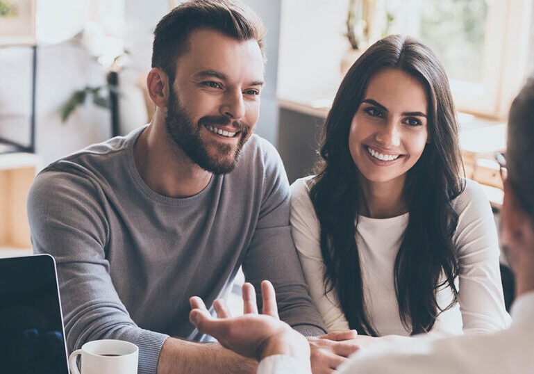 Happy couple discovers the advantages of personal financial planning