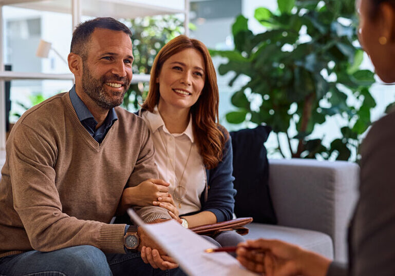 High-net-worth investor in business suit meeting with financial advisor to discuss private credit investment opportunities