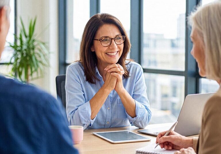 Financial advisor meeting with clients to discuss tax-efficient investments, asset location and strategies to reduce tax drag and improve long-term after-tax returns