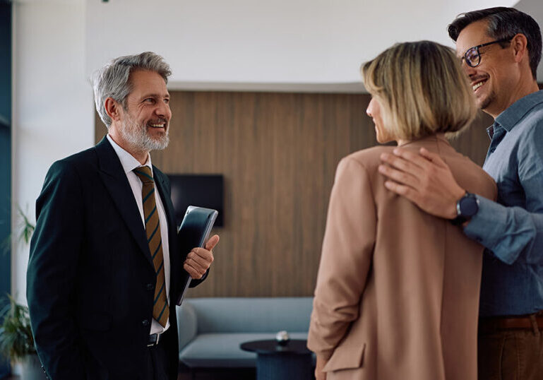 Family meeting with a financial advisor to discuss starting a family office, outsourced advisory services and multigenerational wealth planning.