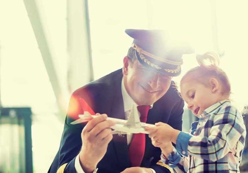 Airline pilot going through divorce plays with child