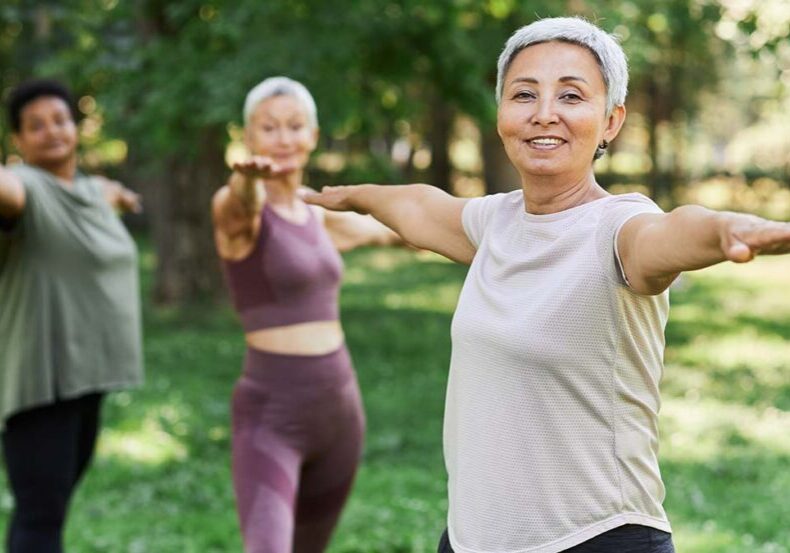 Senior woman does tai chi while thinking about retirement