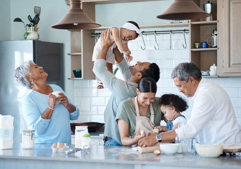 Shot of a multigenerational family baking together in the kitchen.