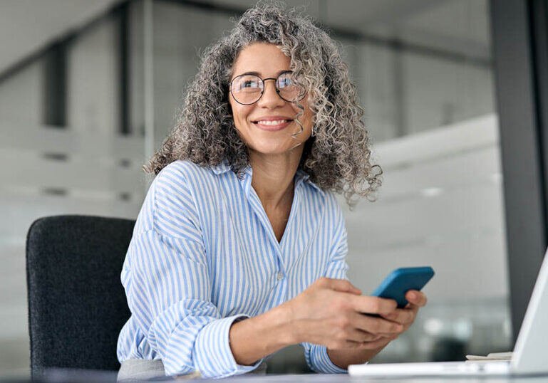 mature business woman contemplates her concentrated stock positions