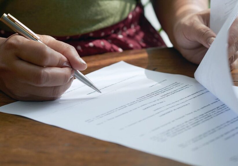 Woman filling out paperwork