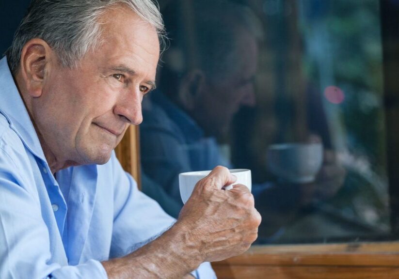 Man drinking coffee and considering retirement